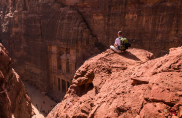 backpacker on a cliff, Al Khazneh - Petra, Jordan_1129335632
