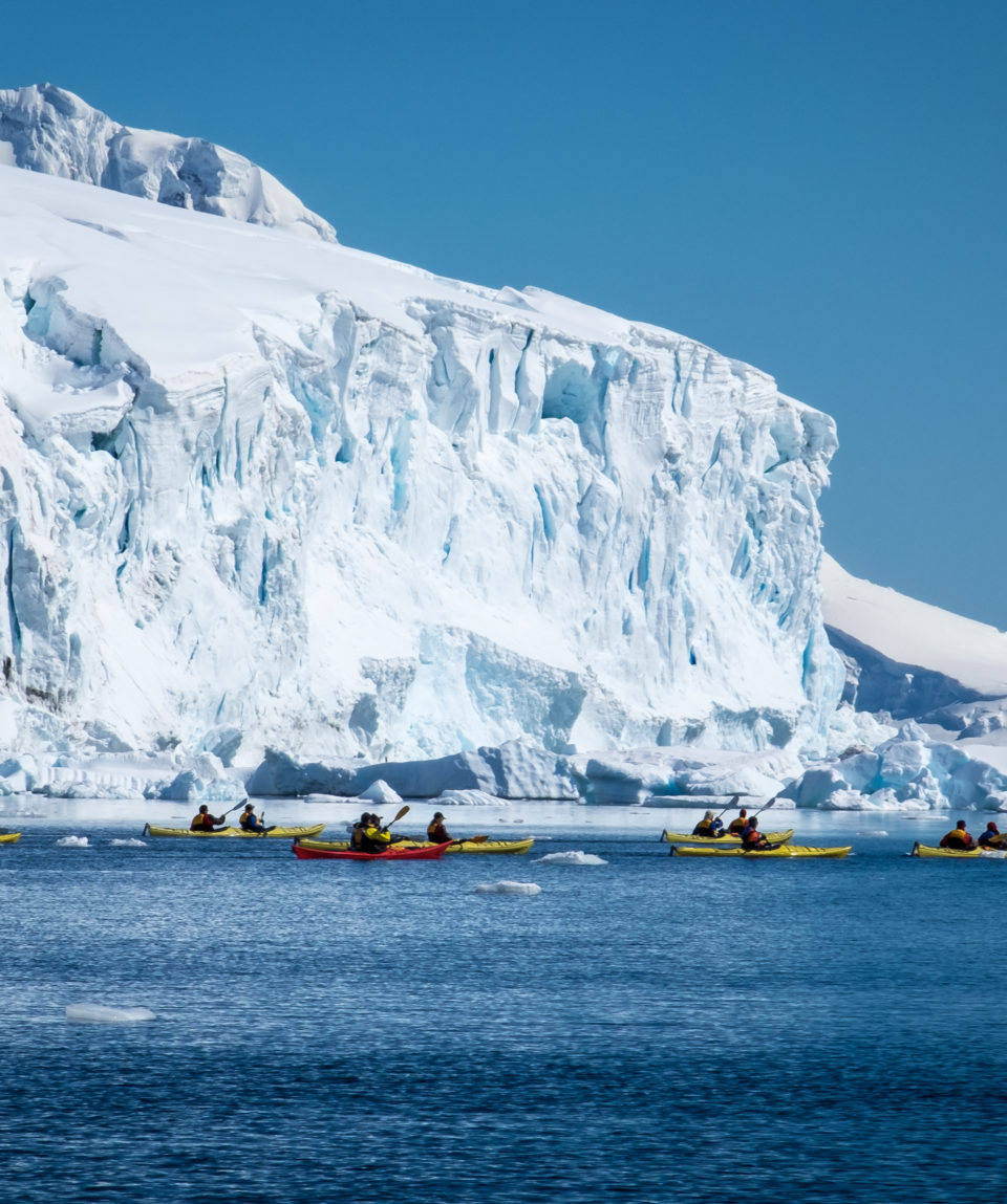 Kayaking in Front of Icy Cliffs